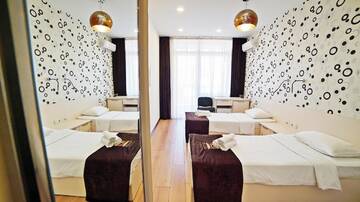 Фото номера Стандартный двухместный номер с 2 отдельными кроватями Отель Mardi Plaza Hotel г. Батуми 3