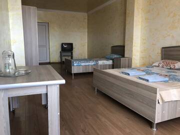 Фото номера Стандартный трехместный номер Отель M-Palace Hotel г. Батуми 5
