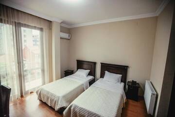 Фото номера Стандартный двухместный номер с 2 отдельными кроватями Отель Hotel Riva г. Батуми 5