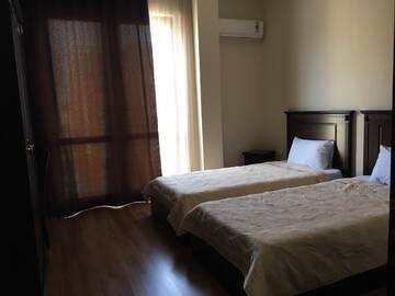 Фото номера Стандартный двухместный номер с 2 отдельными кроватями Отель Hotel Riva г. Батуми 4