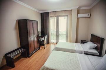 Фото номера Стандартный двухместный номер с 2 отдельными кроватями Отель Hotel Riva г. Батуми 10