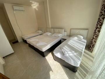 Фото номера Четырехместный номер с ванной комнатой Гостевой дом Rudi Guest House г. Батуми 29