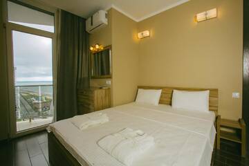 Фото номера Апартаменты Делюкс Апарт-отели Panorama Sea Tower г. Батуми 9
