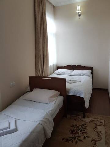 Фото номера Трехместный номер с душем Гостевой дом Nia Guest House г. Батуми 5
