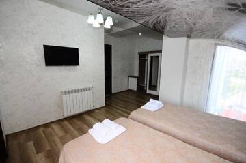 Фото номера Двухместный номер с 2 отдельными кроватями Отель Dream Tower г. Батуми 4