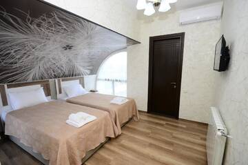 Фото номера Двухместный номер с 2 отдельными кроватями Отель Dream Tower г. Батуми 5
