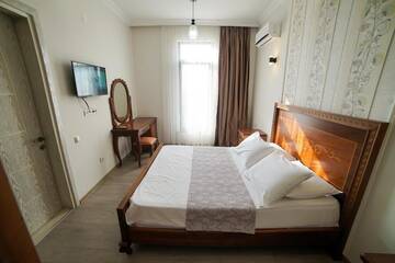 Фото номера Люкс с 1 спальней Гостевой дом Guest House Holiday Village г. Батуми 8