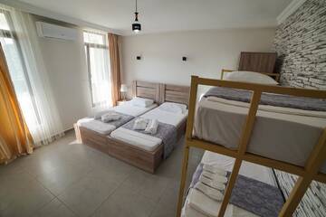 Фото номера Семейный номер с балконом Гостевой дом Guest House Holiday Village г. Батуми 3