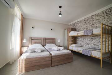 Фото номера Семейный номер с балконом Гостевой дом Guest House Holiday Village г. Батуми 8