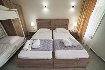 Фото номера Семейный номер с балконом Гостевой дом Guest House Holiday Village г. Батуми 15