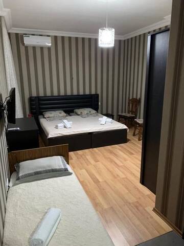 Фото номера Двухместный номер Делюкс с 1 кроватью и душем Гостевой дом New Boulevard г. Батуми 21