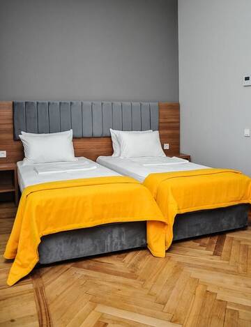 Фото номера Стандартный семейный номер Гостевой дом palm hotel г. Батуми 7
