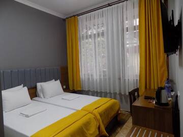Фото номера Стандартный двухместный номер с 1 кроватью Гостевой дом palm hotel г. Батуми 3